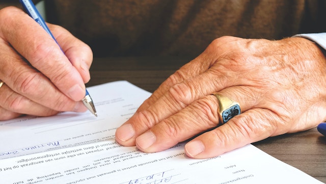 person signing a contract